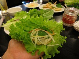 I suppose to put Banh Khot on top of vegetables!
