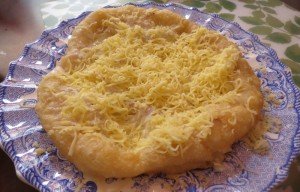 Langosh with cheese, sour cream, and garlic